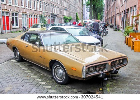 AMSTERDAM, NETHERLANDS - AUGUST 10, 2014: Motor car Dodge Charger at the city street.
