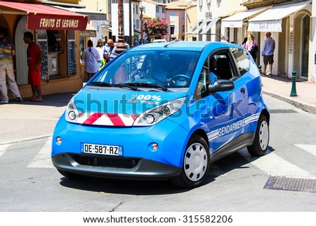 SAINT-TROPEZ, FRANCE - AUGUST 3, 2014: Electric police motor car Bollore Bluecar at the city street.
