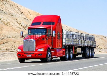 ATACAMA, CHILE - NOVEMBER 14, 2015: Red semi-trailer truck Kenworth T660 at the Pan-American Highway.