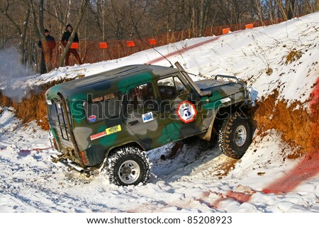 UFA, RUSSIA - DECEMBER 18: Off-road vehicle UAZ (No. 3) of team ROTAS during annual trophy raid Natural selection on December 18, 2010 in Ufa, Russia.