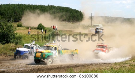 REZH, RUSSIA - JULY 10: Contestants of cross-country truck race at annual Championship of Ural federal district on July 10, 2010 in Rezh, Russia.