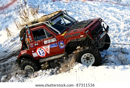UFA, RUSSIA - DECEMBER 18: Off-road vehicle Lada Niva (No. 13) of team BASHOFFROAD during annual trophy raid Natural selection on December 18, 2010 in Ufa, Russia.