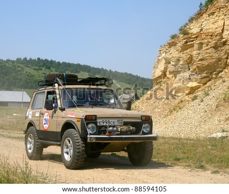 PAVLOVKA, RUSSIA - JUNE 26: Off-road vehicle Lada Niva (No. 20) of Team ROTAS takes part at the annual trophy challenge \