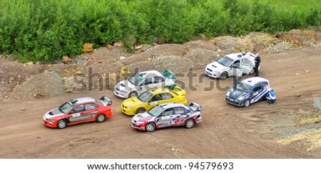BAKAL, RUSSIA - JULY 9: Competitors of the annual Rally Southern Ural at the start place on July 9, 2011 in Bakal, Satka district, Chelyabinsk region, Russia.