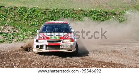 BAKAL, RUSSIA - AUGUST 8: Andrey Yadov\'s Mitsubishi Lancer Evolution (No. 12) competes at the annual Rally Southern Ural on August 8, 2008 in Bakal, Satka district, Chelyabinsk region, Russia.