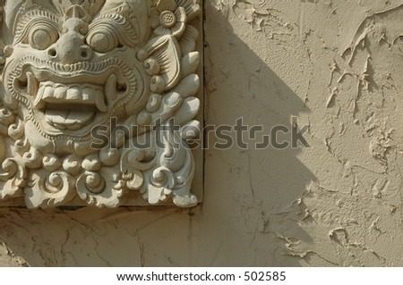 Engraved Mask on the Wall