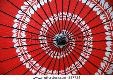 stock photo Red Japanese umbrella with spiral floral design