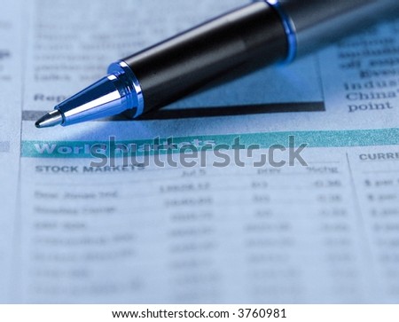 Pen pointing on world markets report