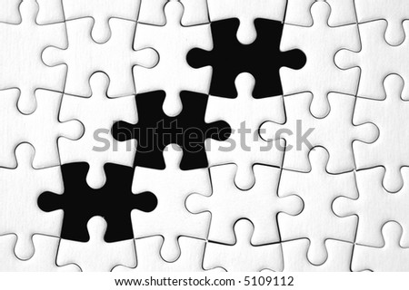 White puzzle with three missing pieces