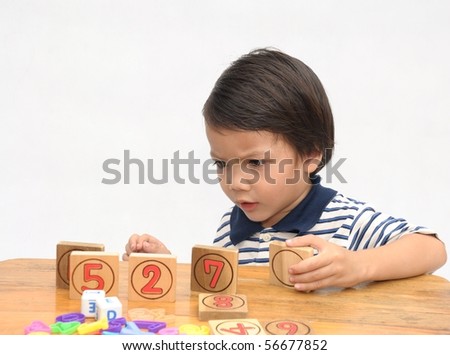 Little boy with number blocks