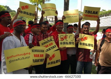 KUALA LUMPUR, MALAYSIA - DEC 5: Protesters in red protest against the water tariff hike in Kuala Lumpur, Malaysia, December 5, 2010.