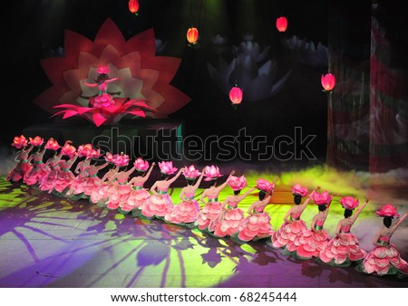 KUALA LUMPUR, MALAYSIA - OCTOBER 12 : Participant perform Chinese lotus dance during The First Ladies Summit October 12, 2010 in Kuala Lumpur.  Chinese make up 26% of Malaysia\'s population.