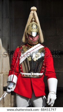 LONDON – SEPTEMBER 24: An unidentified Royal Cavalry is on guard at the Horse Guard Buildings on September 24, 2011 in London, England. The Queens Cavalry was formed more than 130 years ago.