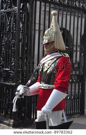 LONDON – SEPTEMBER 24: An unidentified Royal Cavalry is on guard at the Horse Guard Buildings on September 24, 2011 in London, England. The Queens Cavalry was formed more than 130 years ago.