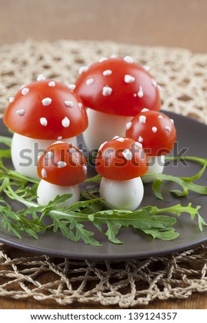 Fly agaric mushrooms made from tomatoes and chicken and quail eggs