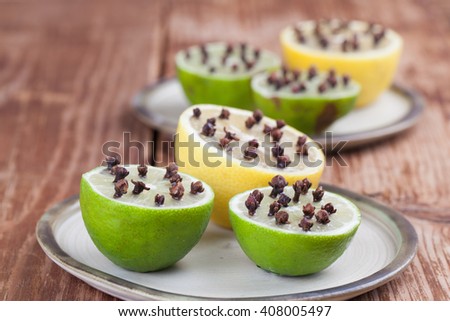 Lemon and limes with cloves, natural insect repellent. Shallow dof