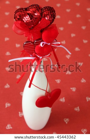Various kinds of heart decorations in a vase