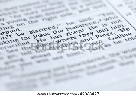 Open Bible with selective focus on the text in Mark 16:6 about Jesus' resurrection: 