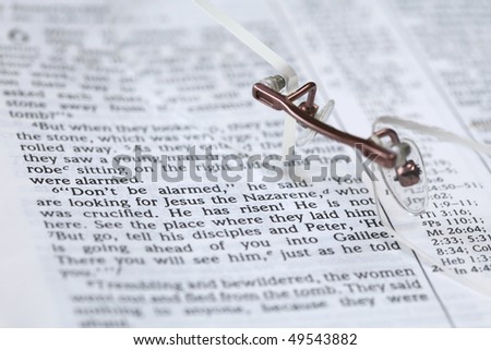 Open Bible with selective focus on the text in Mark 16:6 about Jesus\' resurrection: \