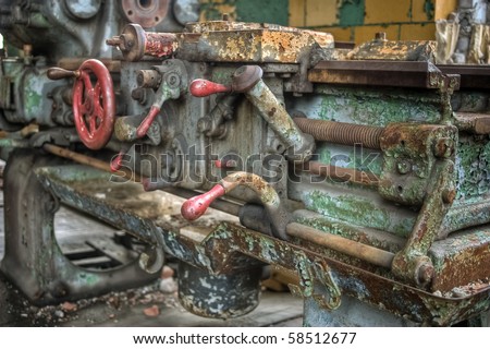 Image of old antique, rusty and dirty machine equipment in an abandoned high school.