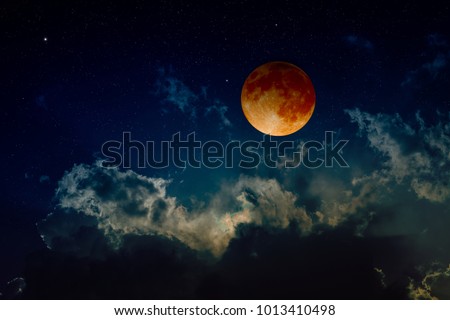 Total lunar eclipse, mysterious natural phenomenon when planet Earth passes between Moon and Sun. Elements of this image furnished by NASA