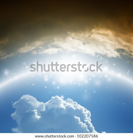 Abstract background - shining rainbow in blue sky with white and dark clouds - heaven and hell