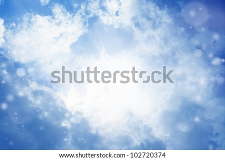 Peaceful background - bright sun shines, blue sky, white clouds - heaven