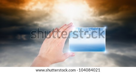 Concept of augmented reality - hand with abstract smartphone, weather forecast