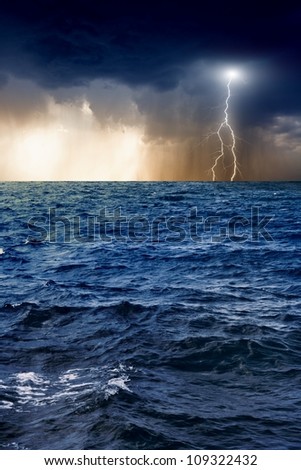 Nature force background - lightning in dark sky, stormy sea
