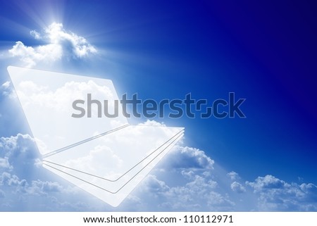 Abstract PC, netbook on blue background with bright lights. Cloud computing.