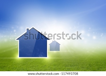 Abstract new house on green field, blue sky, bright sun