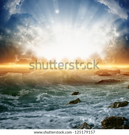 Nature background - beautiful sunrise, bright sun, sea with waves