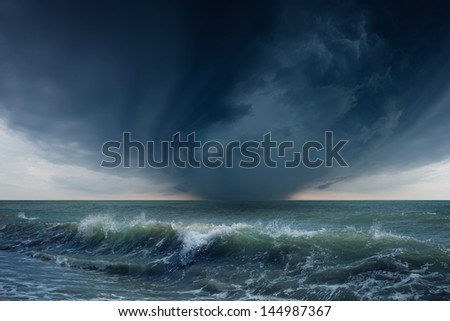 Nature force background - dark stormy sky and sea