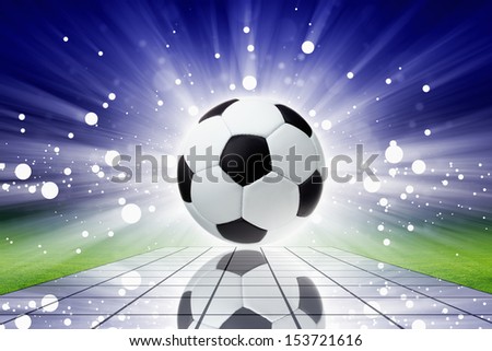 Sports background - soccer ball with reflection, bright spotlights