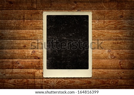 Grungy retro background - old scratched photo on wooden board, panel