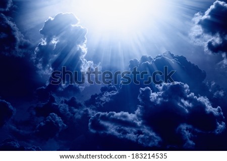 Dramatic background - dark blue sky with bright sun, light from heaven