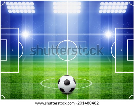Soccer ball on field, arena in night illuminated bright spotlights, soccer goal, green field, soccer field layout, soccer field top view