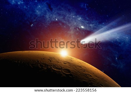 Abstract scientific background - comet approaching planet Mars. Elements of this image furnished by NASA