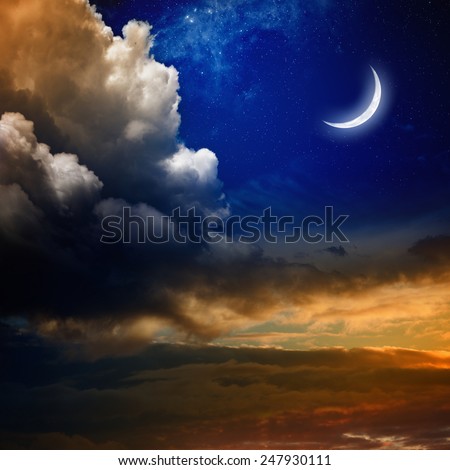 Beautiful nature background - new moon in dark blue sky with stars, glowing sunset clouds. Elements of this image furnished by NASA nasa.gov