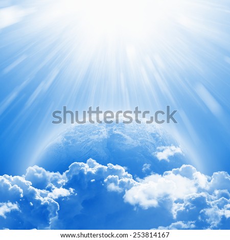 April 22 International Mother Earth Day, blue planet Earth in white clouds, bright sunlight from above. Elements of this image furnished by NASA nasa.gov