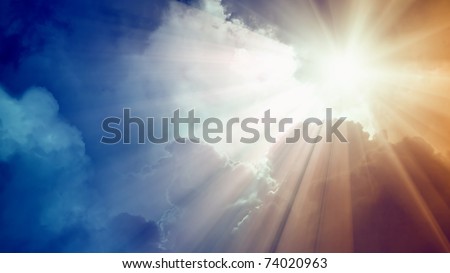 Wide background - bright sun with beams, dark clouds