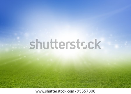 Soft abstract background - bright sun, green field, blue sky