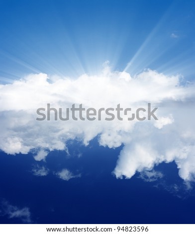 Peaceful background - blue sky, white clouds, bright sun
