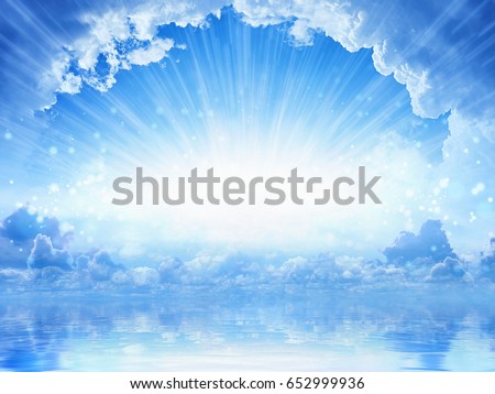 Peaceful heavenly background - light from heaven, bright sunlight with reflection in sea