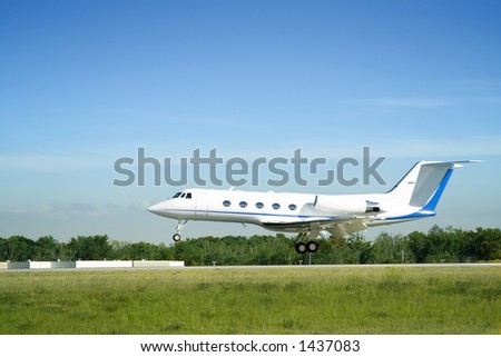 A private jet landing at airport.