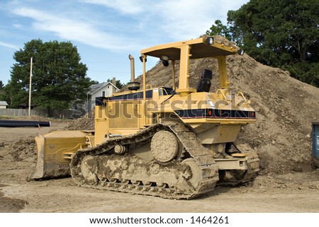 Bulldozer parked in front of a construction project.