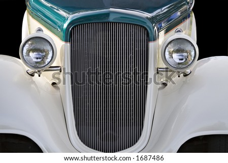 An old Classic American automobile - isolated on black with clipping paths included with file.