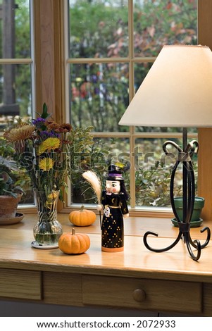 A table decorated with halloween and fall decorations.