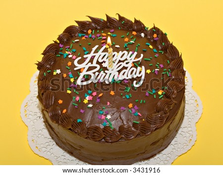 Birthday Cake  Candles on Chocolate Birthday Cake With Lit Candle And Sprinkles  Stock Photo