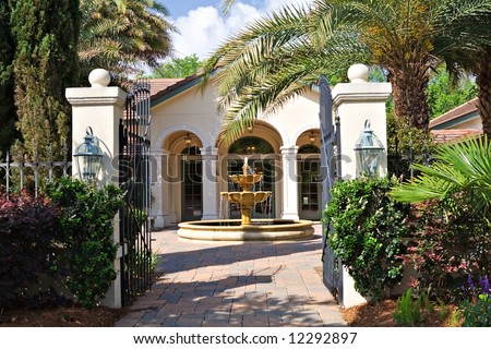 A beautiful courtyard with fountain in front of South Carolina home.